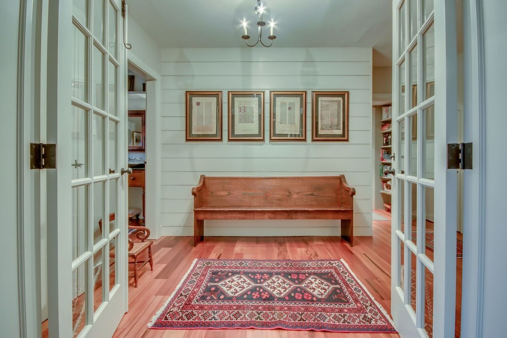 Inspiration for a medium sized country foyer in Philadelphia with white walls, medium hardwood flooring, a double front door, a glass front door and brown floors.