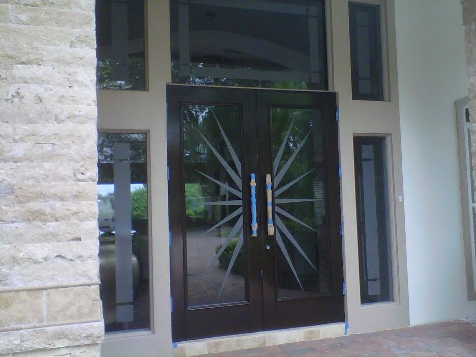 Modern front door in Miami with a double front door and a glass front door.