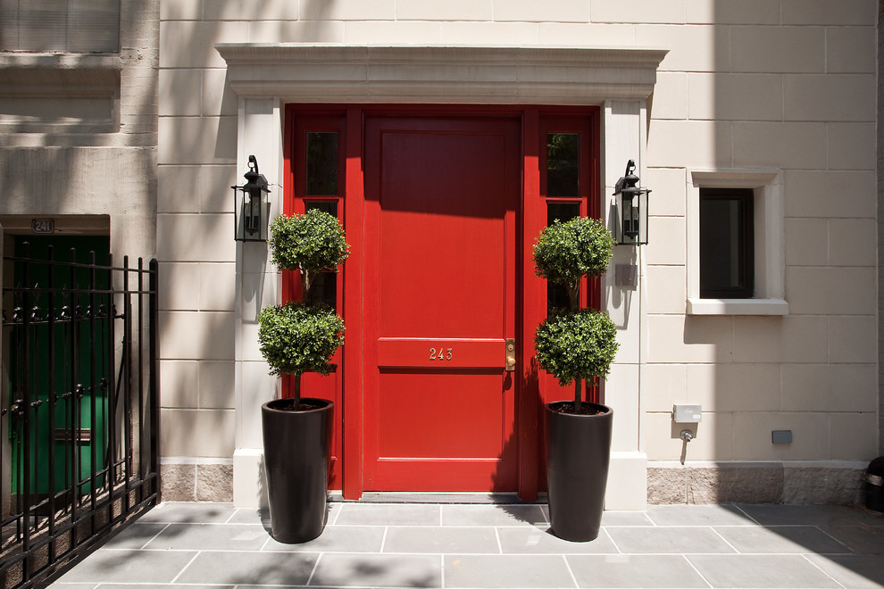 Photo of a traditional front door in New York with beige walls and a red front door.