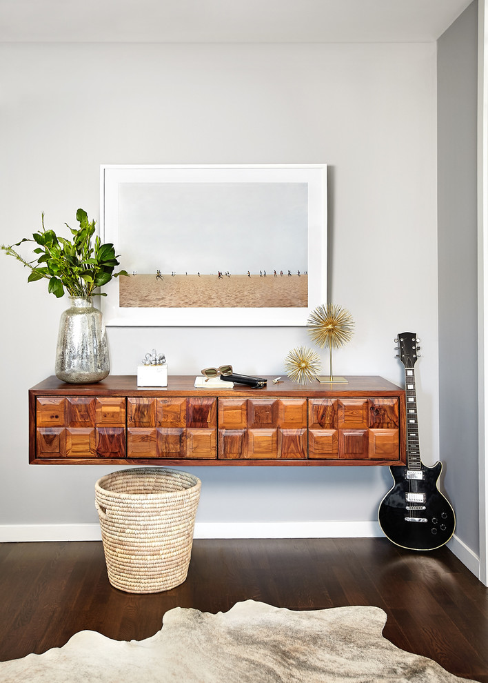 Trendy dark wood floor entryway photo in San Francisco with gray walls