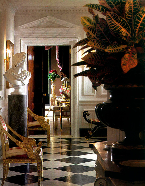 Inspiration for a large timeless painted wood floor foyer remodel in New York with white walls