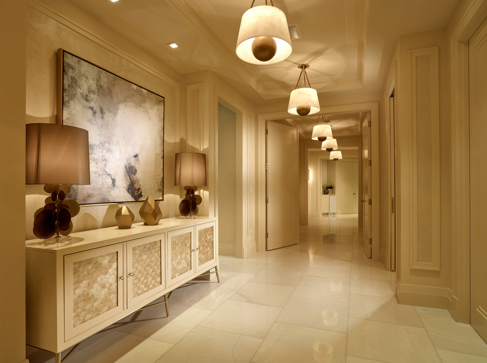 Foyer - large transitional marble floor foyer idea in Miami with beige walls