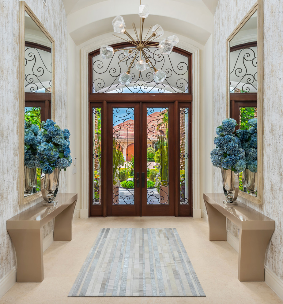 На фото: большое фойе в средиземноморском стиле с серебряными стенами, мраморным полом, двустворчатой входной дверью, стеклянной входной дверью, бежевым полом, кессонным потолком и обоями на стенах с