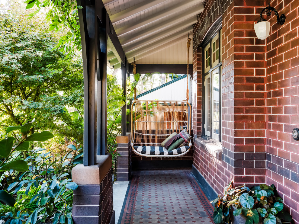 Classic entrance in Sydney with brown walls, ceramic flooring, a single front door, a black front door and multi-coloured floors.