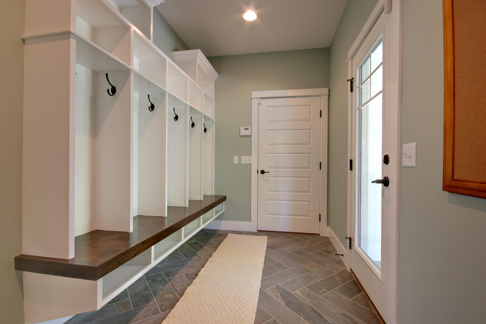 Inspiration for an expansive classic entrance in Grand Rapids with green walls and ceramic flooring.
