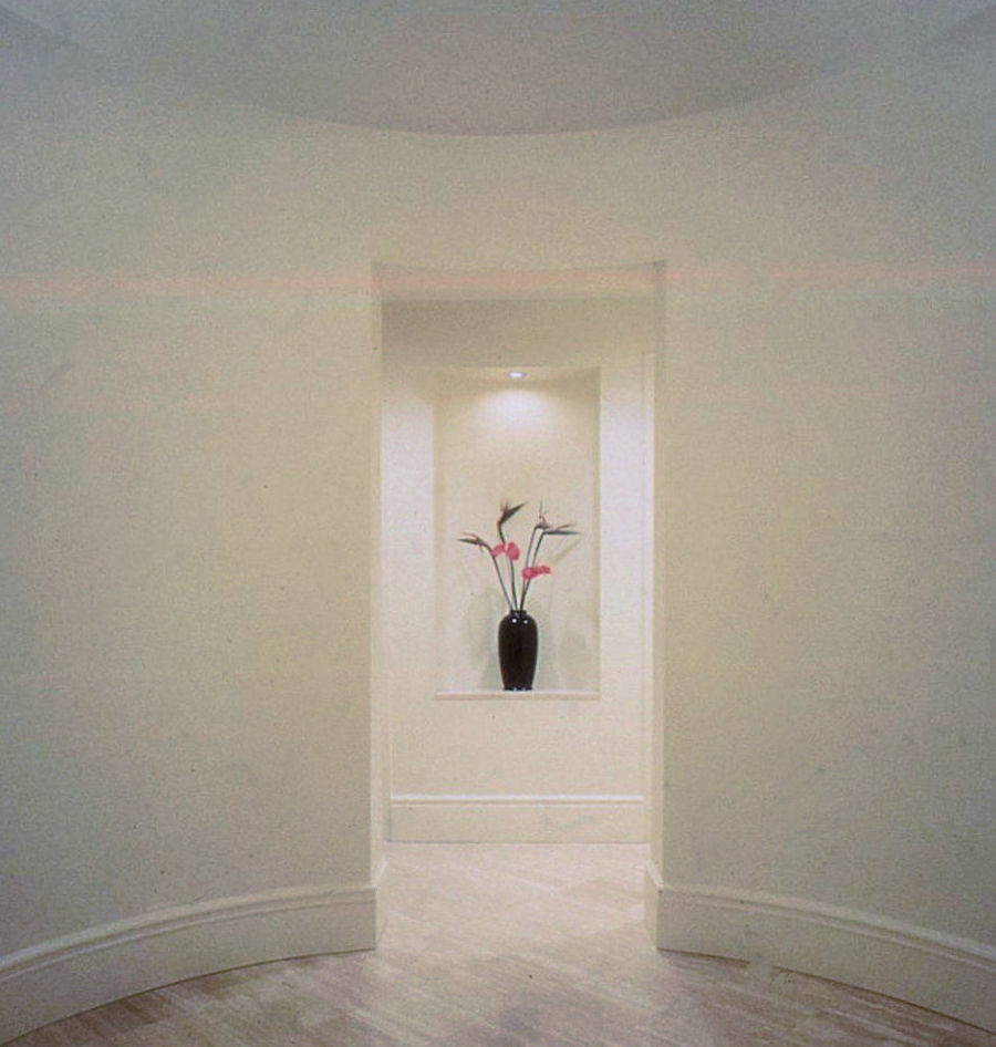 Photo of an expansive entrance in New York with white walls and limestone flooring.