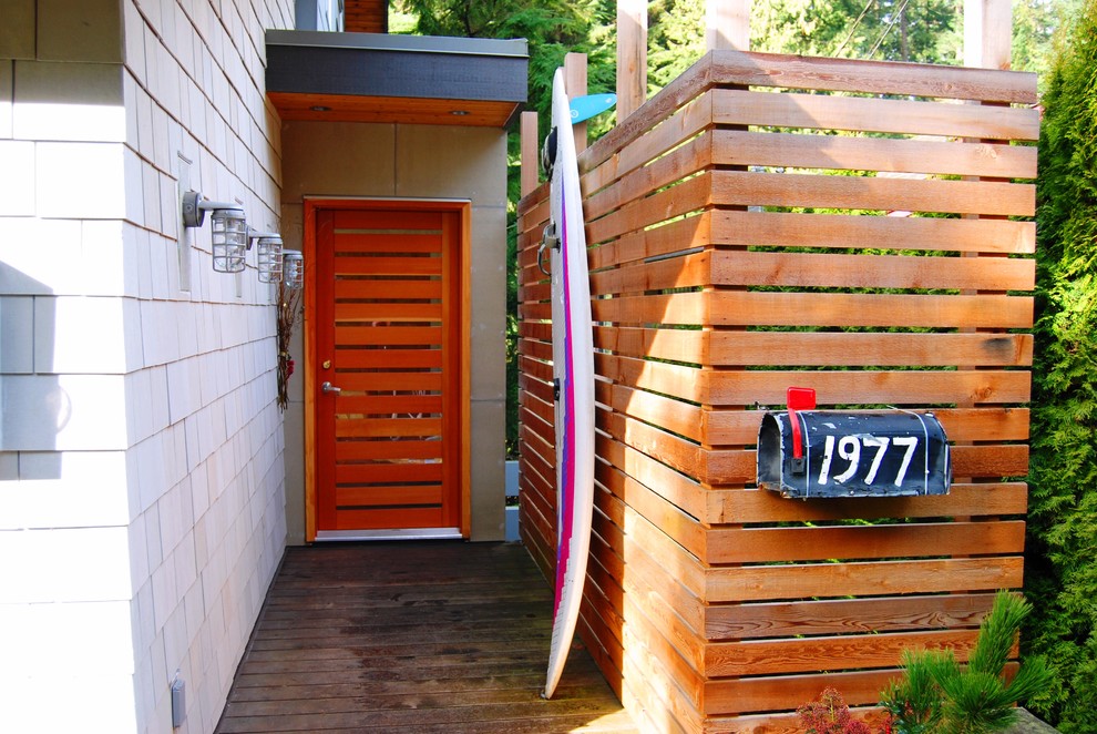 Photo of a beach style front door in Vancouver with a single front door.