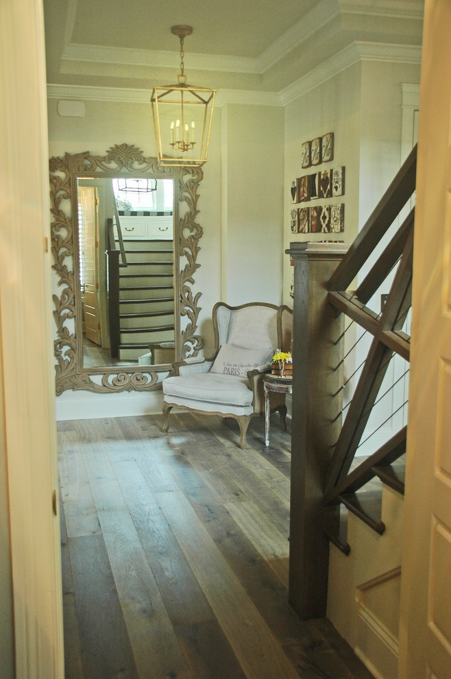 Design ideas for a large rural foyer in Chicago with grey walls and medium hardwood flooring.