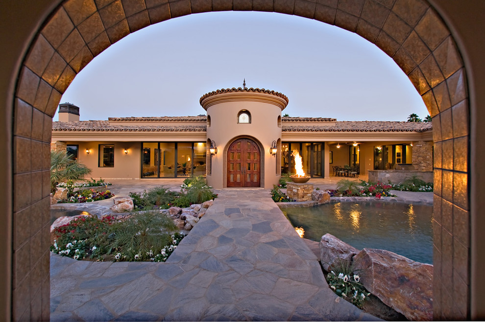 Example of a tuscan double front door design in Other