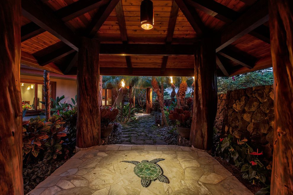 Design ideas for a large world-inspired foyer in Hawaii with a double front door and a dark wood front door.