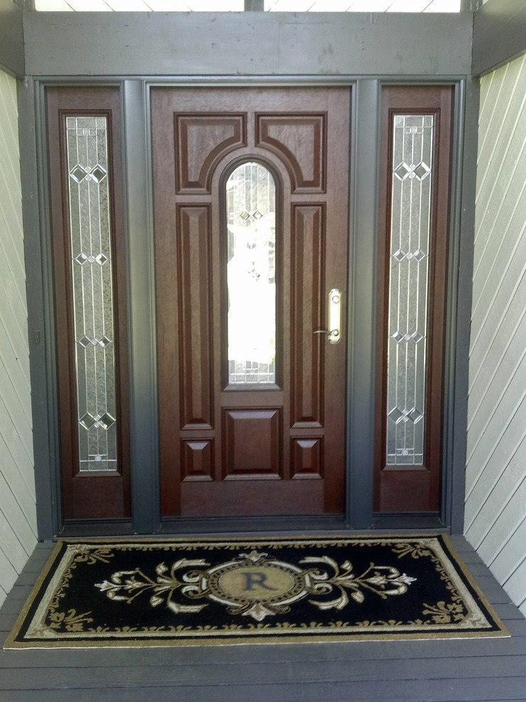 Design ideas for a front door in Other with grey walls.