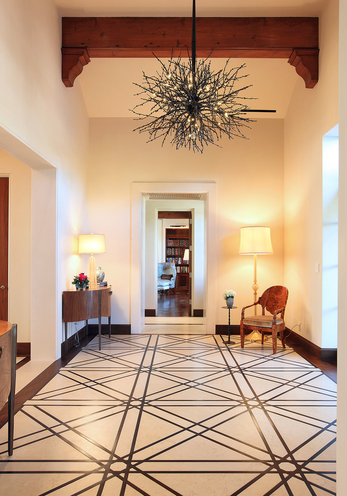 Design ideas for an expansive mediterranean foyer in San Francisco with white walls, a single front door and a metal front door.