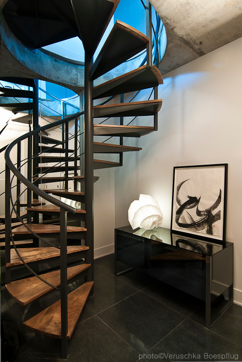 Photo of a medium sized contemporary staircase in Montreal.