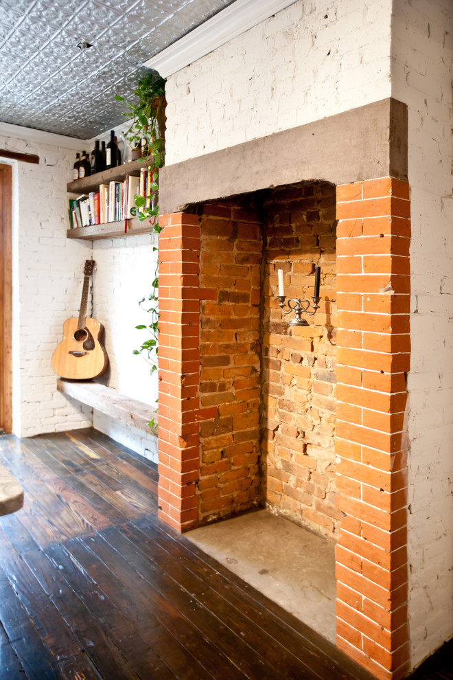 Entryway - rustic dark wood floor entryway idea in New York with white walls