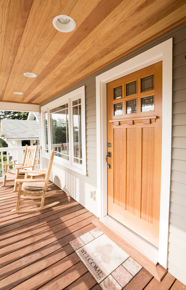 Photo of a traditional entrance in Seattle with a single front door and feature lighting.