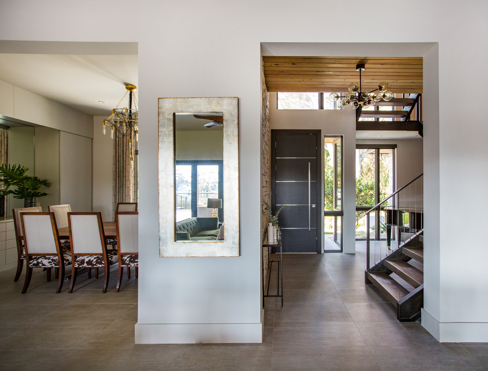 Large contemporary entrance in Jacksonville with grey walls, porcelain flooring, a single front door, a dark wood front door and grey floors.
