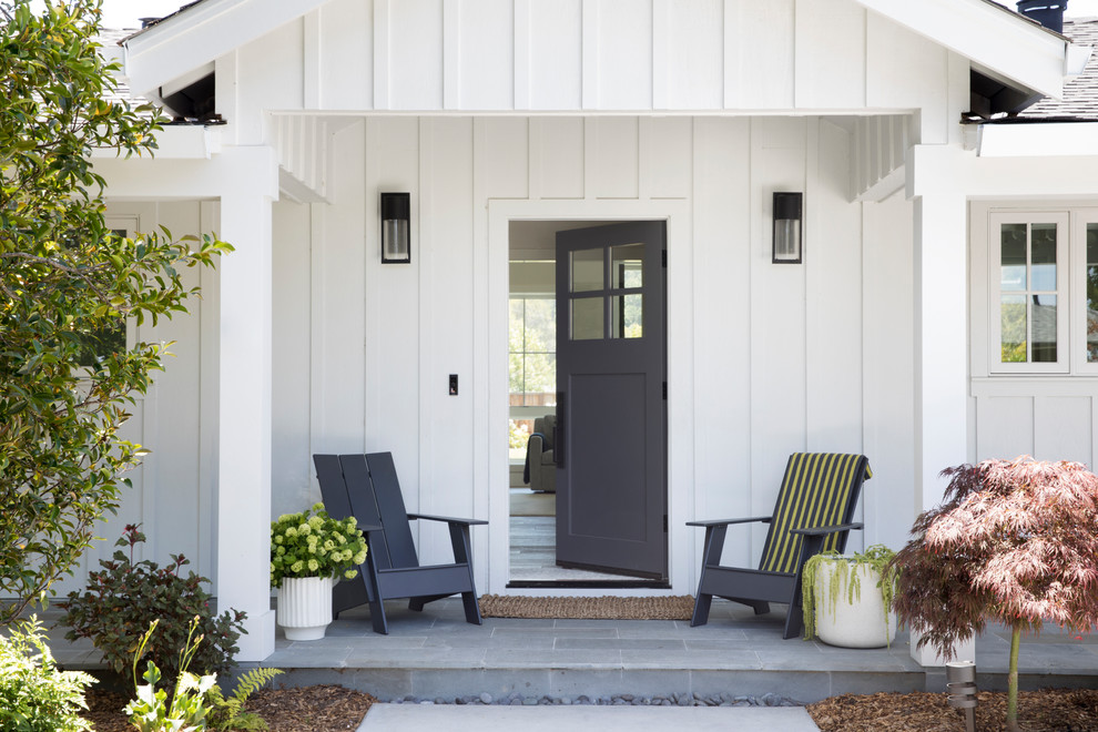 This is an example of a medium sized farmhouse front door in San Francisco with a single front door and a grey front door.