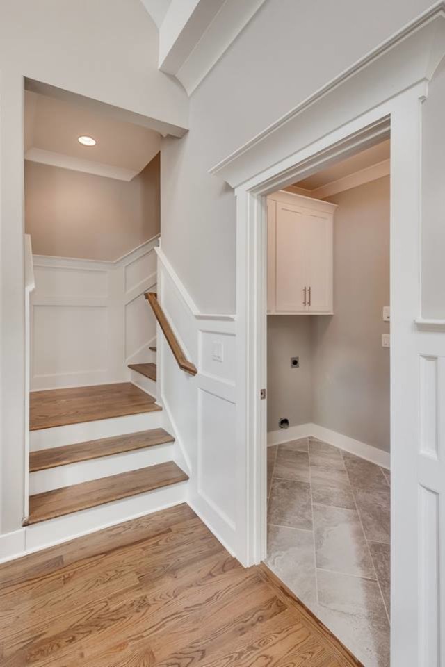 Large traditional boot room in Other with grey walls, medium hardwood flooring, a single front door and a white front door.