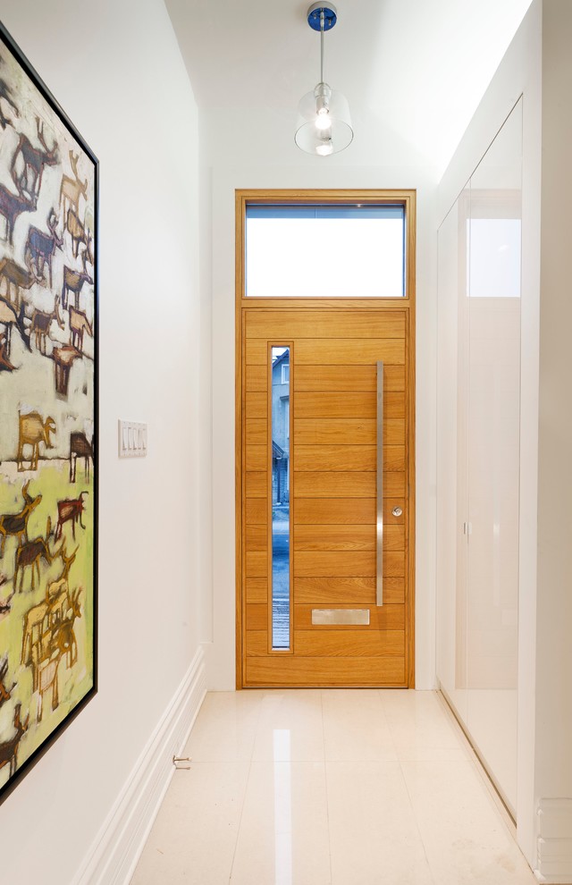 Entryway - contemporary entryway idea in Ottawa with white walls