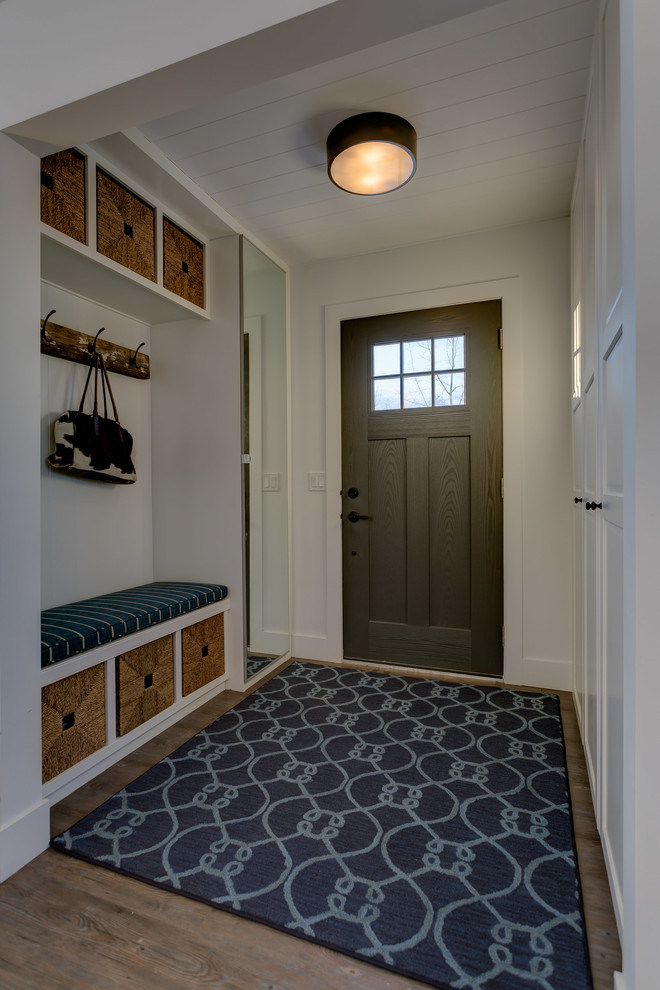 Inspiration for a medium sized farmhouse vestibule in Calgary with white walls, vinyl flooring, a single front door, a grey front door, grey floors and feature lighting.