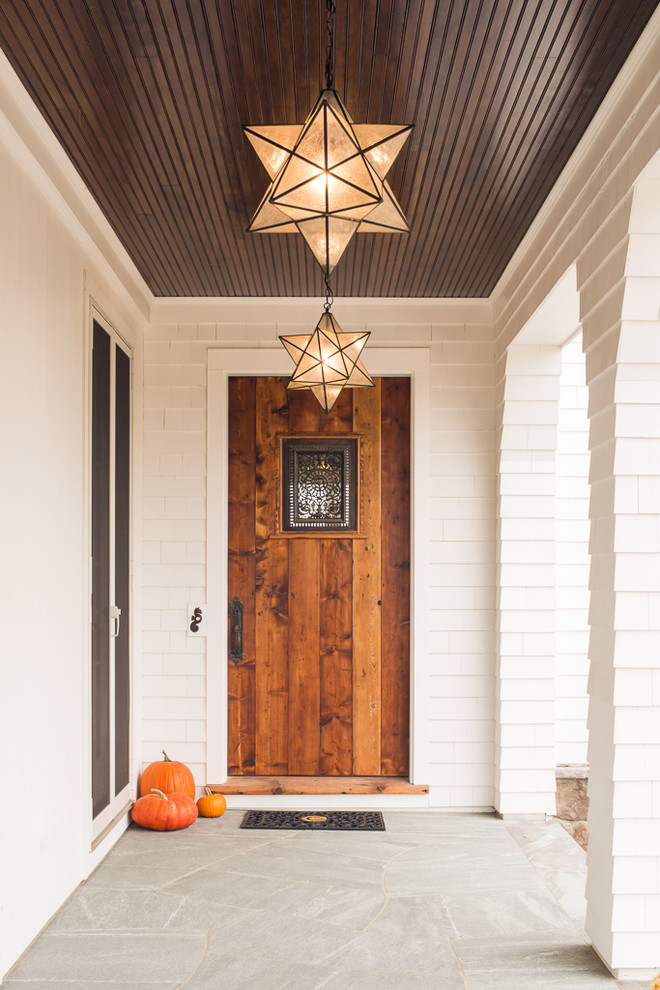 Entryway - coastal entryway idea in Portland Maine with a medium wood front door