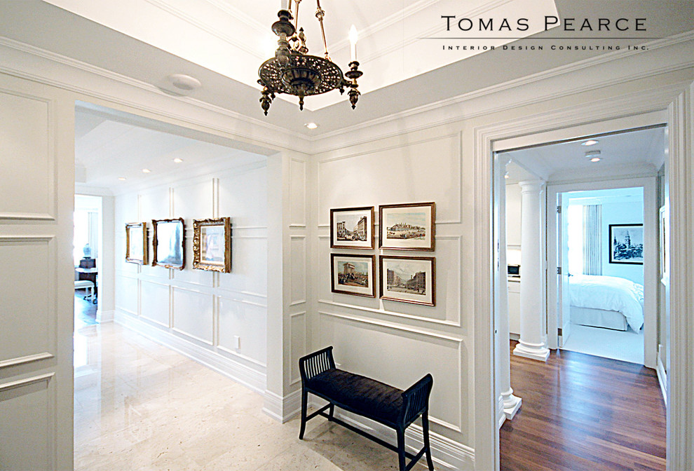 Entry hall - mid-sized transitional marble floor entry hall idea in Toronto