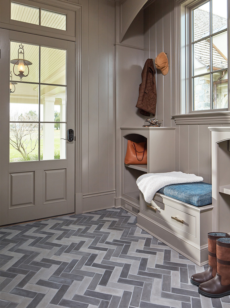 Design ideas for a traditional entrance in Baltimore with grey walls, a single front door, a grey front door and grey floors.