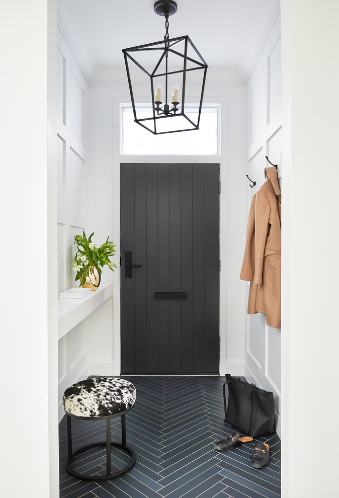 Design ideas for a classic hallway in Toronto with white walls, a single front door, a grey front door and blue floors.
