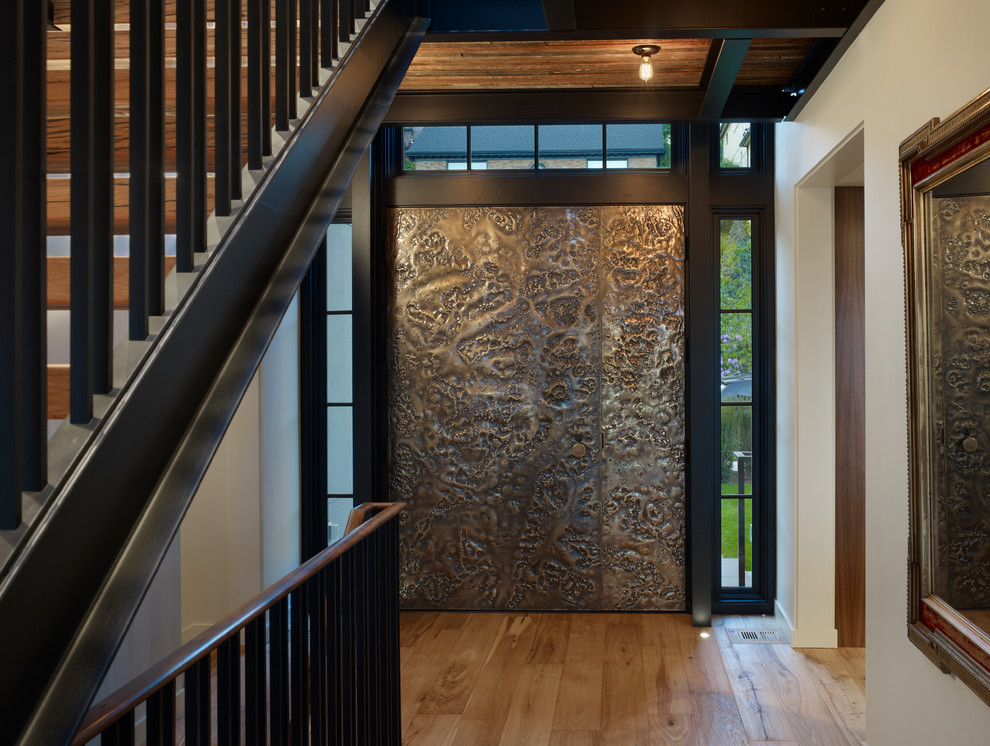 Trendy entryway photo in Seattle with a brown front door