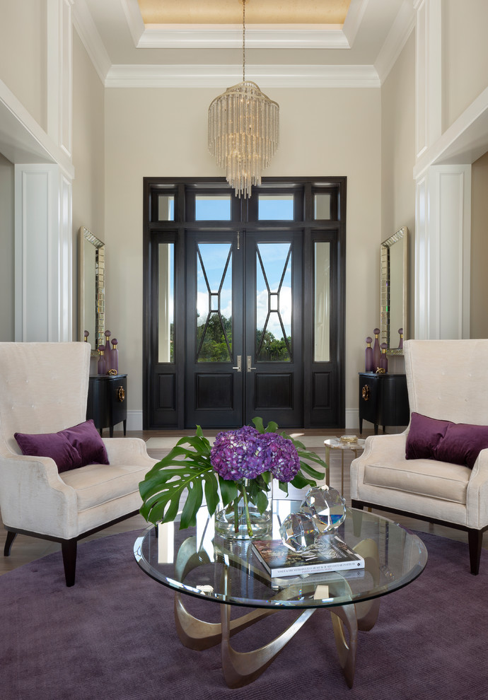 Mid-sized trendy dark wood floor and brown floor entryway photo in Miami with beige walls and a glass front door