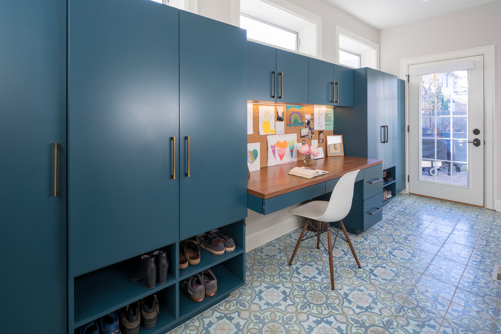 Example of a large eclectic multicolored floor mudroom design in Chicago with white walls