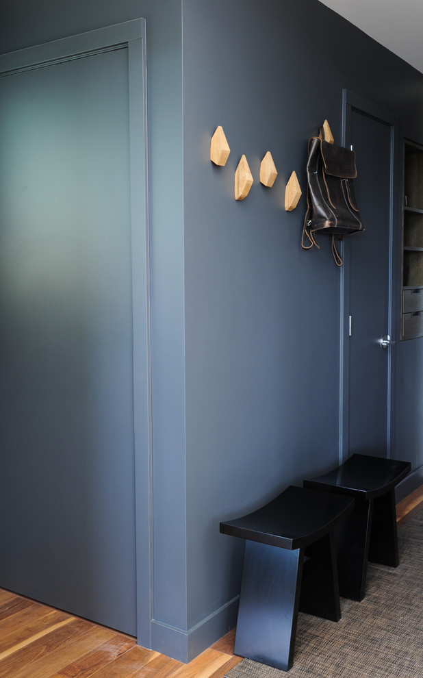 Example of a small trendy entryway design in Vancouver with gray walls