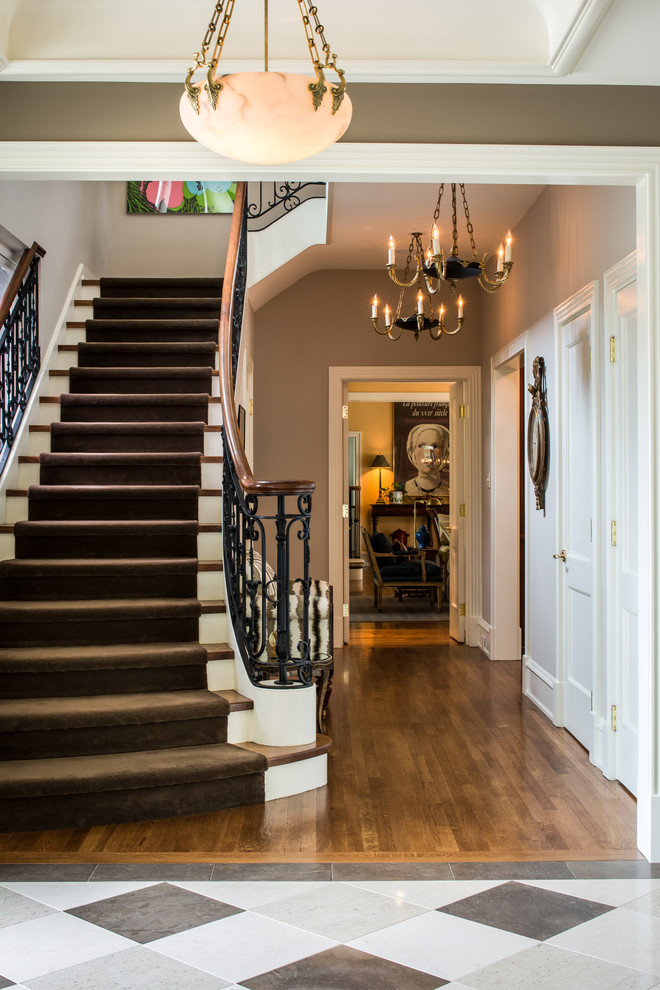 Photo of a large classic foyer in Philadelphia with beige walls, marble flooring and a single front door.
