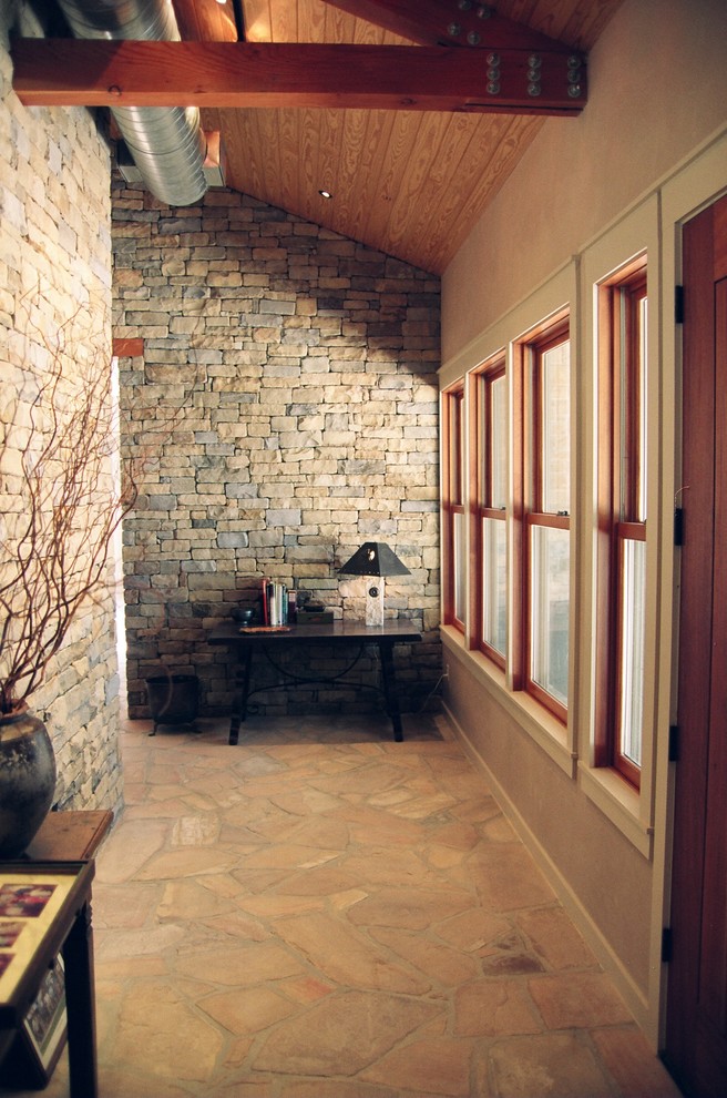 Entryway - small cottage entryway idea in Houston with beige walls and a dark wood front door