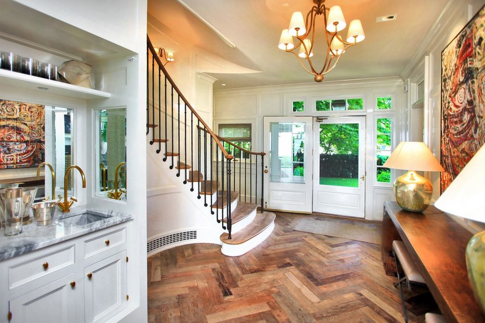 Photo of a medium sized traditional foyer in New York with beige walls, dark hardwood flooring, a single front door, a white front door and brown floors.