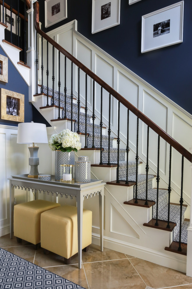 Inspiration for a large classic foyer in New York with blue walls, medium hardwood flooring, a single front door, a white front door and feature lighting.