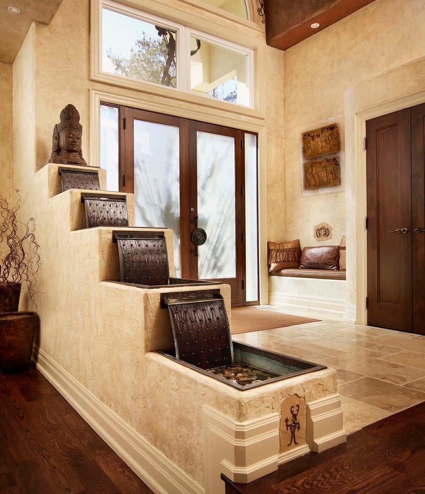 Mid-sized mountain style travertine floor entryway photo in Toronto with beige walls and a glass front door