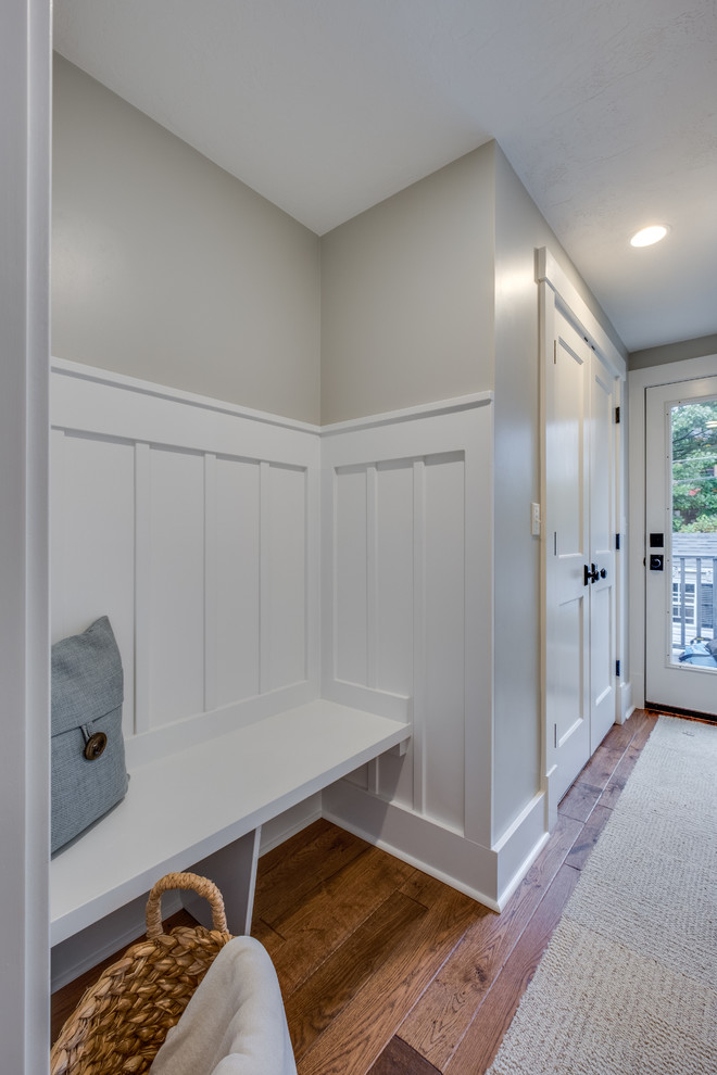 Design ideas for a small classic boot room in Other with beige walls, medium hardwood flooring, a single front door, a white front door and brown floors.