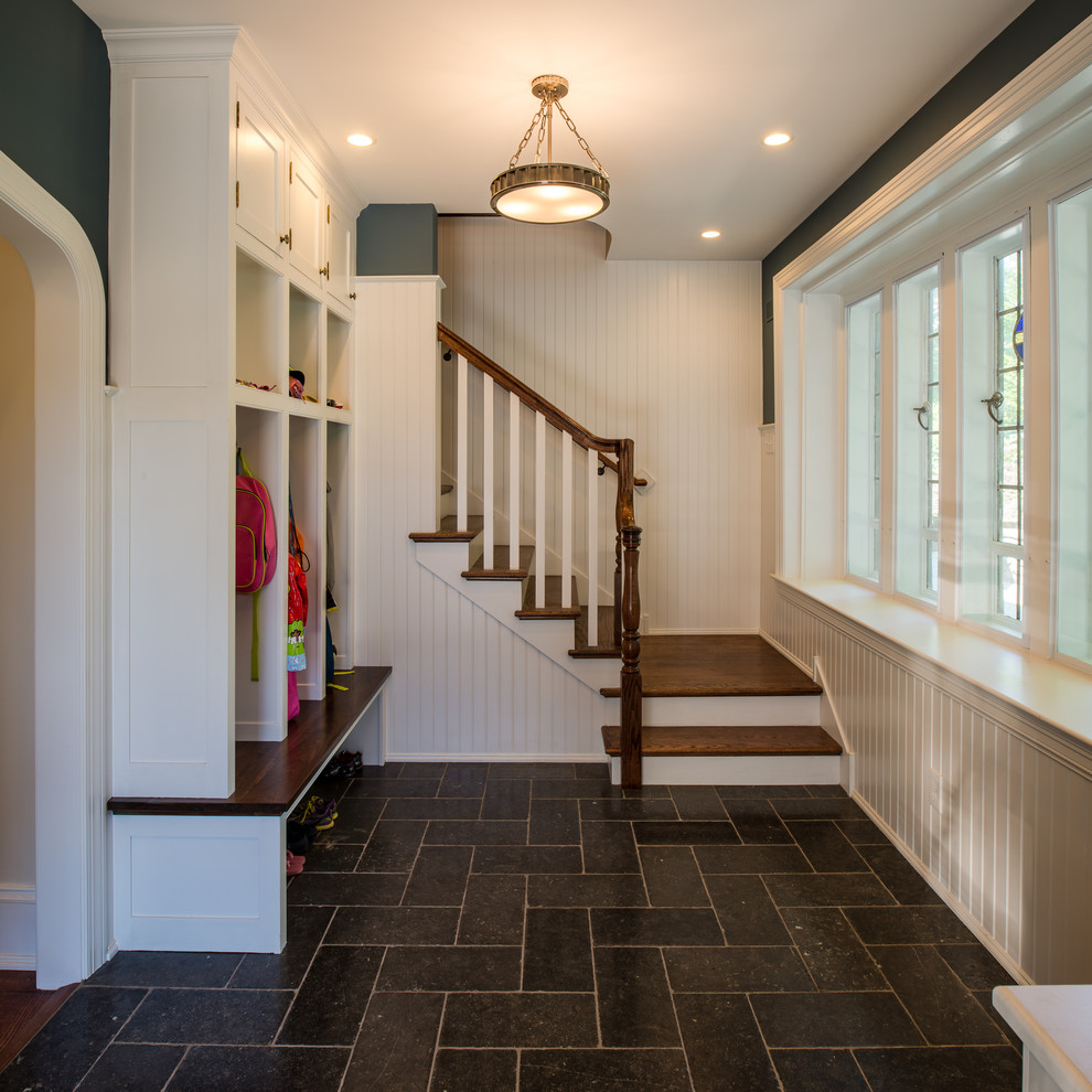 Mudroom - traditional slate floor and black floor mudroom idea in Philadelphia with blue walls