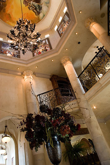 Design ideas for an expansive mediterranean foyer in Sacramento with beige walls and porcelain flooring.