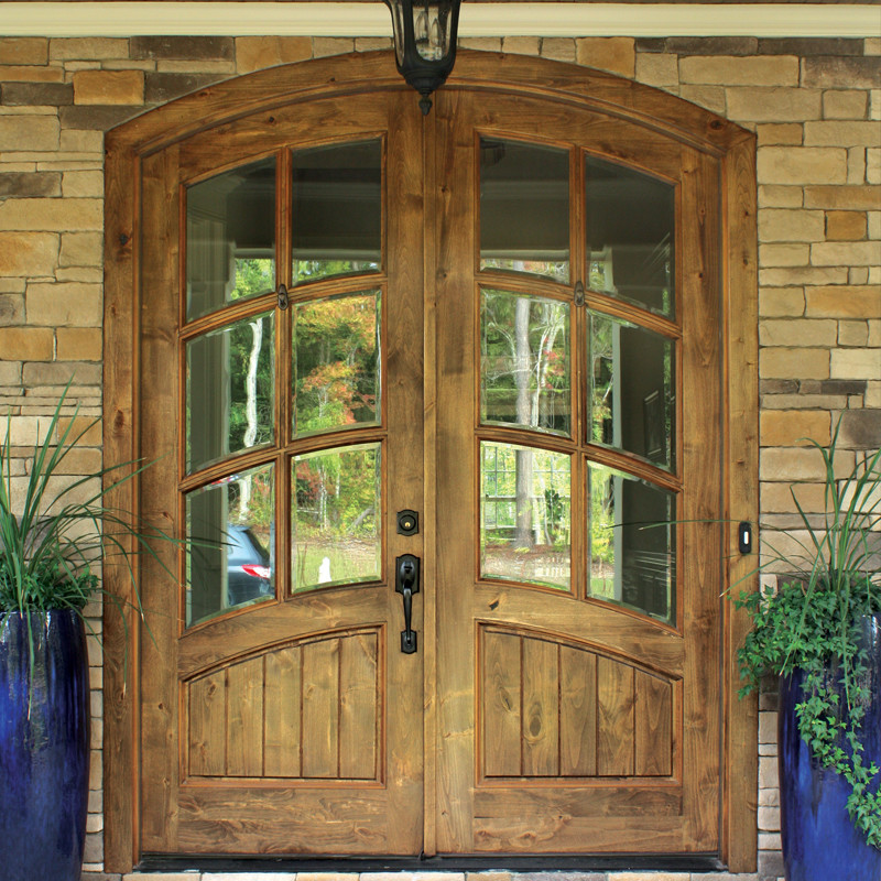 Photo of a rustic front door in Austin with a double front door and a light wood front door.