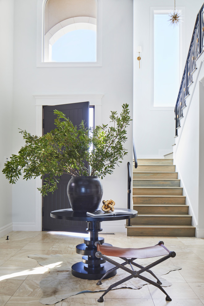 Design ideas for an expansive classic foyer in Other with white walls, travertine flooring, a single front door, a black front door, beige floors and a vaulted ceiling.