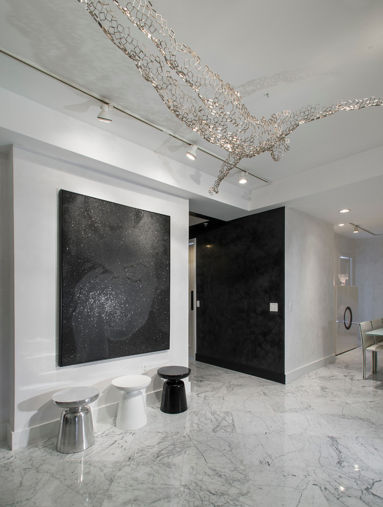Mid-sized trendy marble floor foyer photo in Boston with white walls