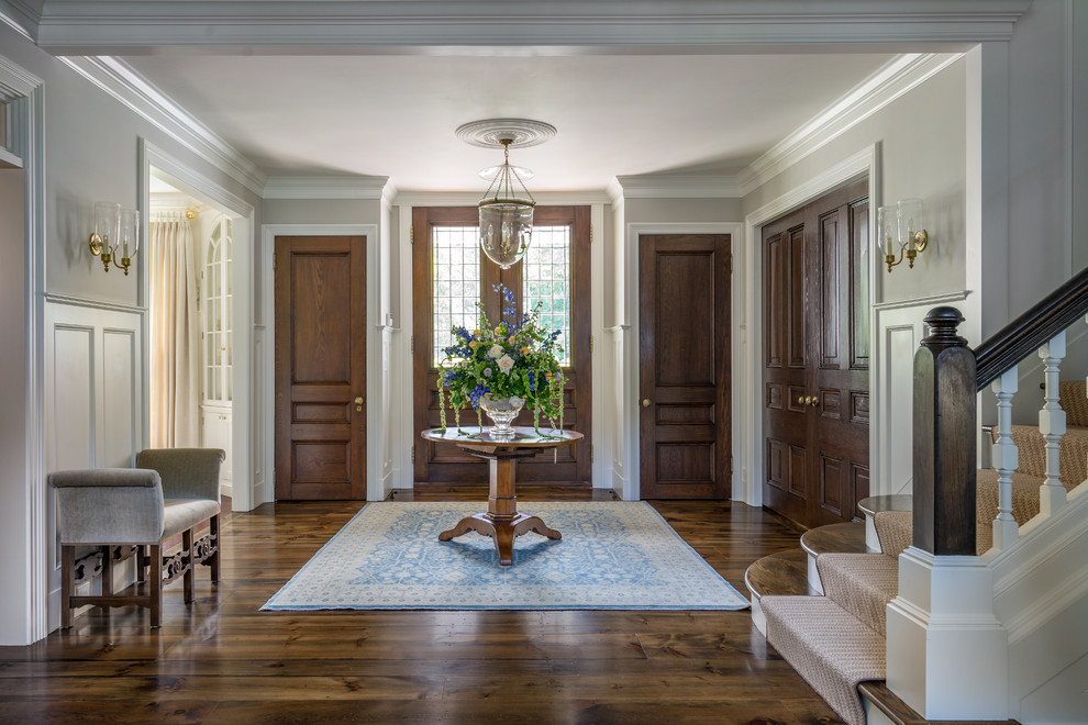 Photo of a traditional foyer in Boston with grey walls, dark hardwood flooring, a double front door and a glass front door.