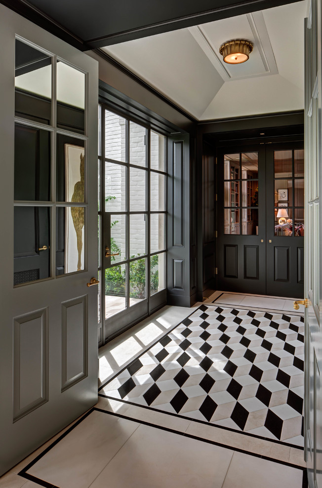 Classic vestibule in Houston with black walls, white floors and feature lighting.