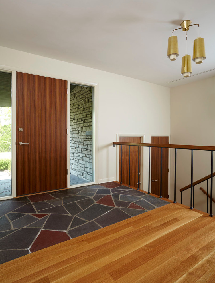 Inspiration for a modern slate floor entryway remodel in Minneapolis
