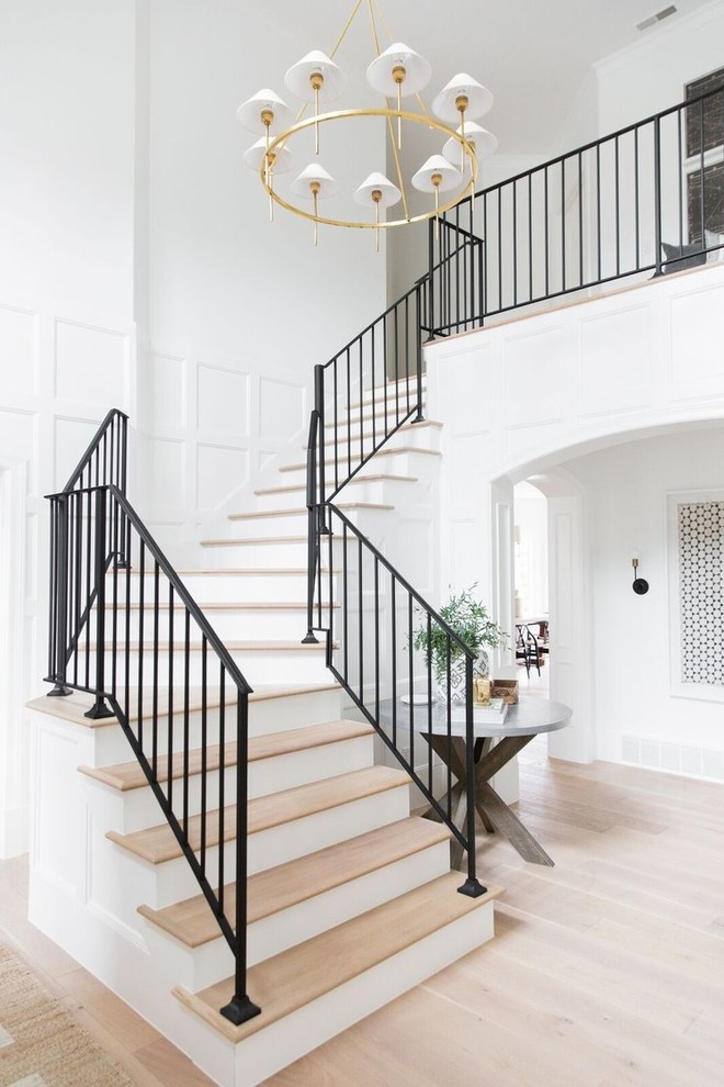 Example of a large transitional staircase design in Salt Lake City