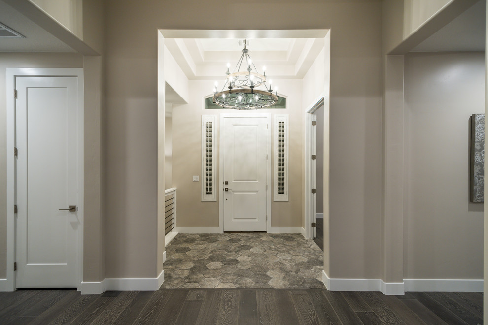 Photo of a classic foyer in Salt Lake City with beige walls, a single front door and a white front door.