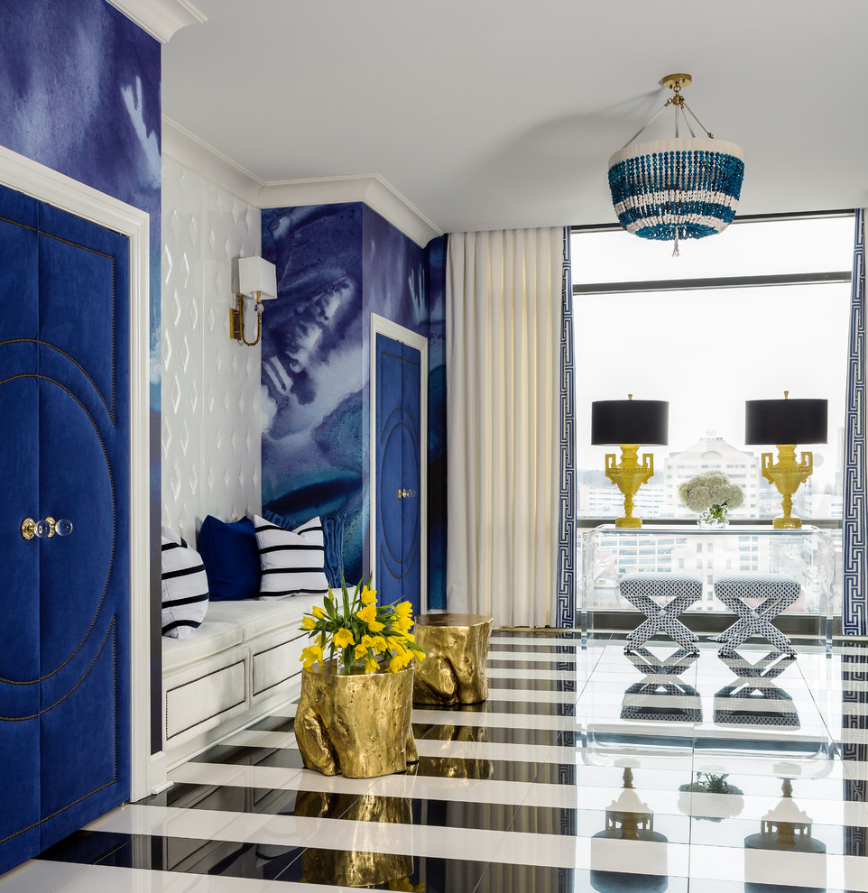 На фото: прихожая среднего размера в современном стиле с мраморным полом, синими стенами, двустворчатой входной дверью, синей входной дверью и разноцветным полом с