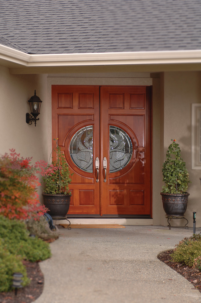 Rogue Valley Entry Doors Textured wooden double with decorative glass